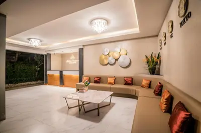 a living room with a couch and a table at Phi Phi Anita Resort in Phi Phi Don