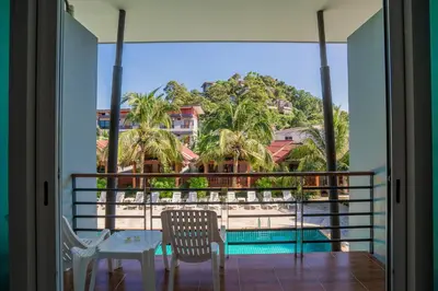 a view from the balcony of a resort with a table and chairs at Phi Phi Anita Resort in Phi Phi Don