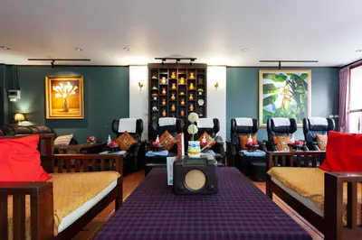 a hair salon with a bunch of chairs in a room at Baumancasa Beach Resort in Karon Beach