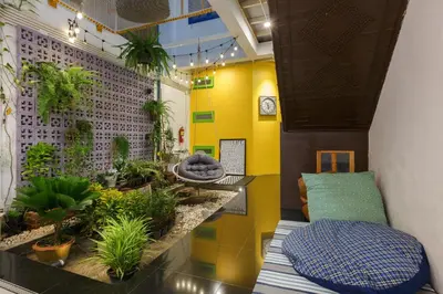a room with potted plants on the wall at Aekkeko hostel in Phuket Town