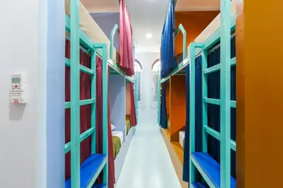 a corridor of a room with colorful bunk beds at Aekkeko hostel in Phuket Town