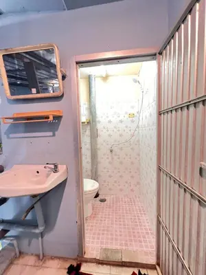 a bathroom with a shower and a sink at J Mansion in Ao Nang Beach
