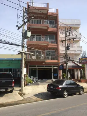 a black car parked in front of a building at Naithon Beach Residence in Nai Thon Beach