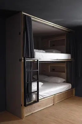 a bunk bed room with two bunk beds at Borbaboom Phuket Poshtel & Hostel in Phuket Town
