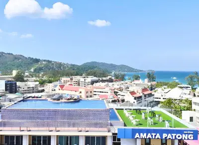 a view of a city with buildings and the ocean at Amata Patong in Patong Beach