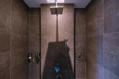 a bathroom with a shower with a glass door at Bungalow VILLA Rumba in Ko Yao Noi