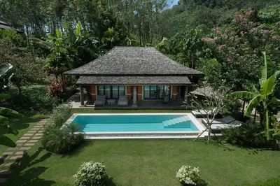 a house with a swimming pool in a yard at Bungalow VILLA Cha Cha in Ko Yao Noi