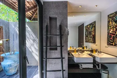 a bathroom with two sinks and a mirror at Bungalow VILLA Cha Cha in Ko Yao Noi