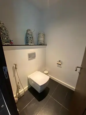 a bathroom with a white toilet in a room at Bungalow VILLA Cha Cha in Ko Yao Noi