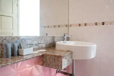 a bathroom with a sink and a mirror at Memory Karon Resort in Karon Beach