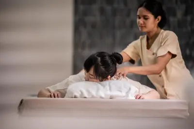 a woman is getting a massage from a patient at Areca Resort and Spa in Kathu