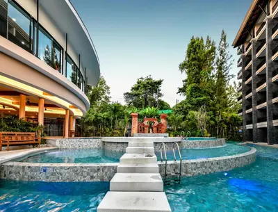 a swimming pool in the middle of a building at Areca Resort and Spa in Kathu