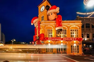 a building with a mickey mouse sign on it at Book a Bed Poshtel - SHA Plus in Phuket Town