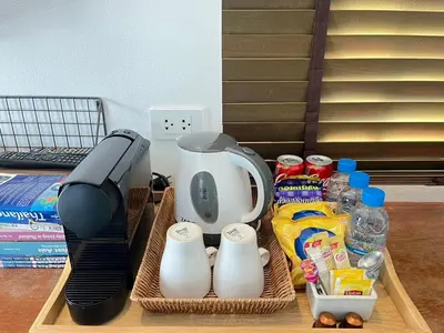 a tray with a coffee maker and a blender at Book a Bed Poshtel - SHA Plus in Phuket Town
