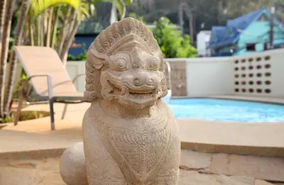 a statue of a lion in front of a pool at ViLLa JUNGLE 3 BEDROOMS in Kamala Beach