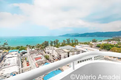 a view of the city from the balcony of a building at Patong Tower Amazing Sea View 12 by PHR in Patong Beach