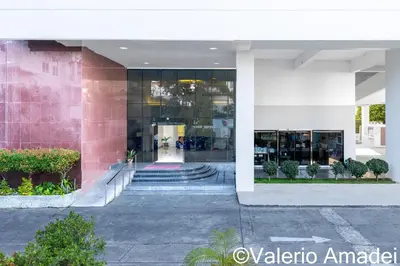 a lobby of a building with a staircase in front at Patong Tower Amazing Sea View 12 by PHR in Patong Beach