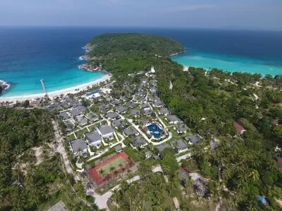 an aerial view of a resort next to the ocean at The Racha in Ko Racha Yai