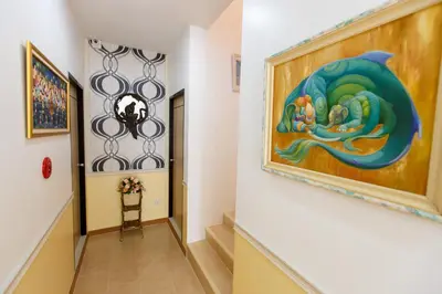 a hallway with a painting of a mermaid on the wall at YaYa B By Briza Group in Chalong