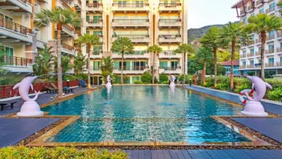 a swimming pool in the middle of a building at Phuket Villa Patong Beach by PHR in Patong Beach