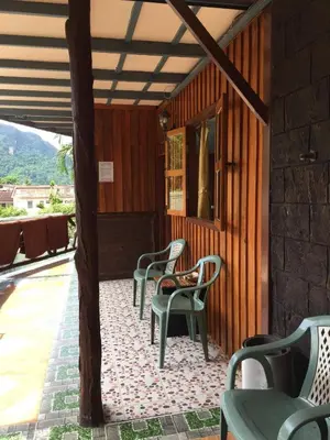 a group of chairs sitting on a patio at Golden Hill Guesthouse in Phi Phi Don