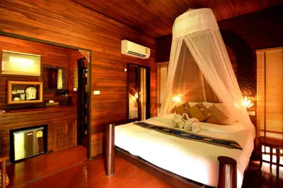 a bedroom with a bed with a canopy at Baan Habeebee Resort in Ao Nang Beach