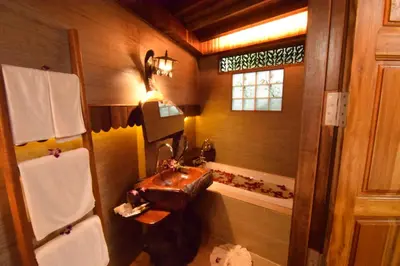 a bathroom with a sink and a mirror at Baan Habeebee Resort in Ao Nang Beach