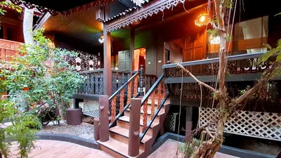 a house with a staircase in front of it at Baan Habeebee Resort in Ao Nang Beach