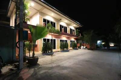 a building with a lot of plants in front of it at KD Residence in Bang Tao Beach