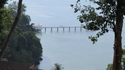 a view of a bridge over the water at 5* 3BR SUITE in Amari Phuket - Patong Beach in Patong Beach