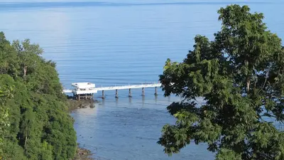 a dock in the middle of a body of water at 5* 3BR SUITE in Amari Phuket - Patong Beach in Patong Beach