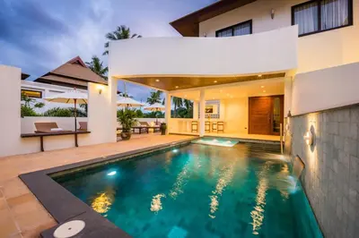 a swimming pool in the backyard of a house at Penthouse Savoye in Ao Nang Beach