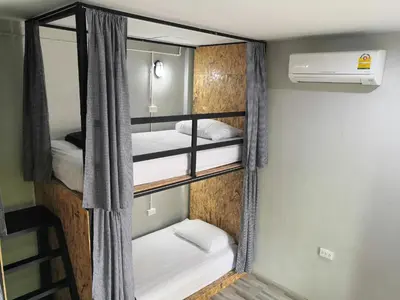 a small room with three bunk beds in it at Backpack Hostel Kohyaoyai in Ko Yao Yai