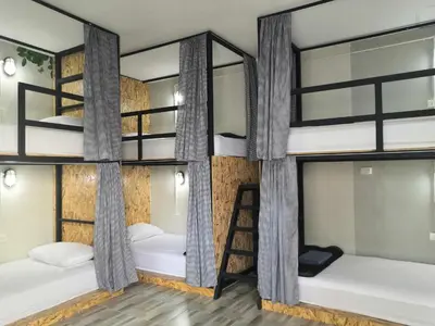 a room with four bunk beds in a hostel at Backpack Hostel Kohyaoyai in Ko Yao Yai