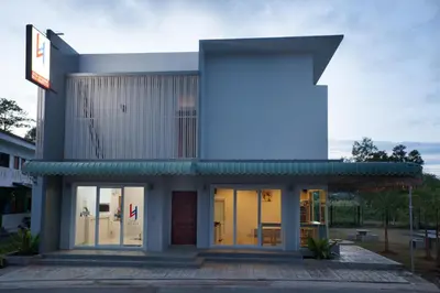 a building with a largeletter k on it at Lin House in Thalang