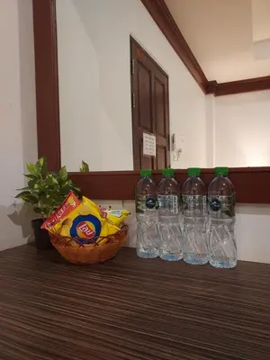 a group of bottles of water sitting on a table at Aromdee at Naithon Beach in Nai Thon Beach