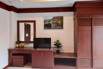 a room with a desk with a tv on it at Aromdee at Naithon Beach in Nai Thon Beach