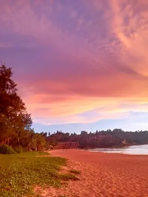 a view of a beach with a sunset at Phuket Green Home in Karon Beach