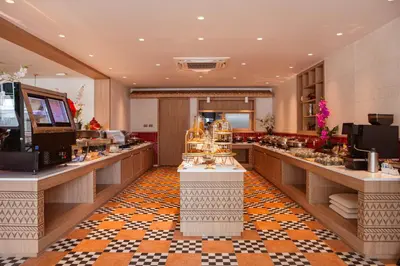 a hair salon with a buffet line in a room at The Lantern Resorts Patong in Patong Beach