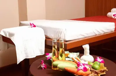 a table with a tray of vegetables on a bed at Karon Princess Hotel SHA EXTRA Plus in Karon Beach