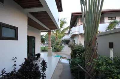 an external view of a house with a courtyard at Babylon Pool Villas in Nai Harn Beach