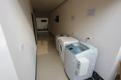 a hospital room with two machines in a hallway at Babylon Pool Villas in Nai Harn Beach