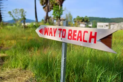 a way to the beach sign in a field at Anissa Resort Koh Yao Yai in Ko Yao Yai