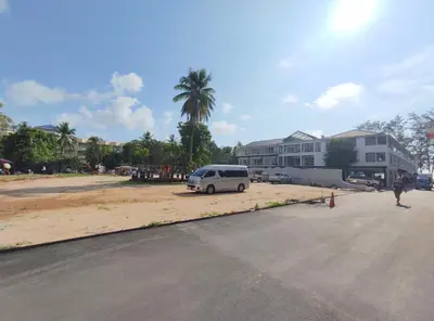 a van parked in a parking lot next to a building at Sea Beach Paradise in Patong Beach