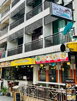 a building with a restaurant on the side of a street at Sea Beach Paradise in Patong Beach