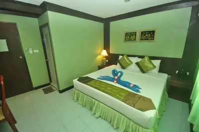 a bedroom with a bed with a blue bow on it at Pak Klong Room for rent in Phi Phi Don