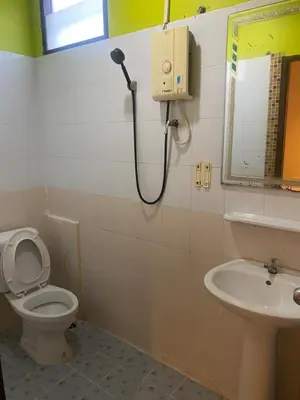 a bathroom with a toilet and a sink at Pak Klong Room for rent in Phi Phi Don