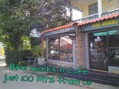 a building with a sign that reads bike works n cafe just lo mis from us at Studio with aircon n kitchen in Bang Tao Beach
