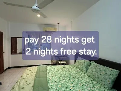 a sign that says pay nights get nights free stay at Soi Bang thao 2 Aircon Studio in Bang Tao Beach