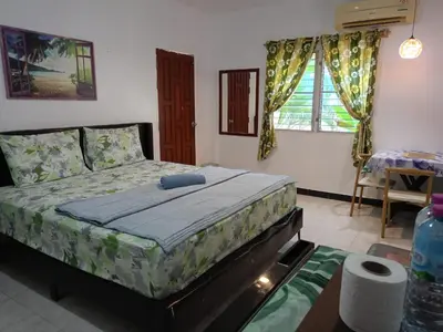 a bedroom with a bed in a room at Soi Bang thao 2 Aircon Studio in Bang Tao Beach